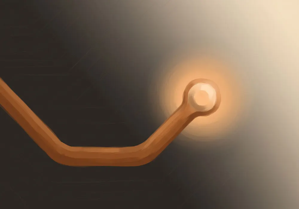 A stylised illustration of a copper circuit trace on a graphite circuit board, resolving to a single glowing solder point.